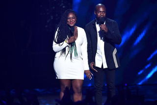 NEW YORK, NY - JULY 11: Co-Founder of Black Lives Matter Alicia Garza (L) and activist/writer/organizer Darnell L. Moore speak onstage during the VH1 Hip Hop Honors: All Hail The Queens at David Geffen Hall on July 11, 2016 in New York City.